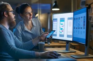 Developer testing app performance and usability on multiple mobile devices