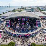 Aerial view of Web Summit 2026 at Altice Arena in Lisbon with thousands of tech attendees on the exhibition floor