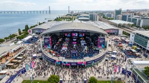 Aerial view of Web Summit 2026 at Altice Arena in Lisbon with thousands of tech attendees on the exhibition floor