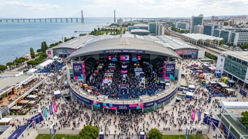 Aerial view of Web Summit 2026 at Altice Arena in Lisbon with thousands of tech attendees on the exhibition floor