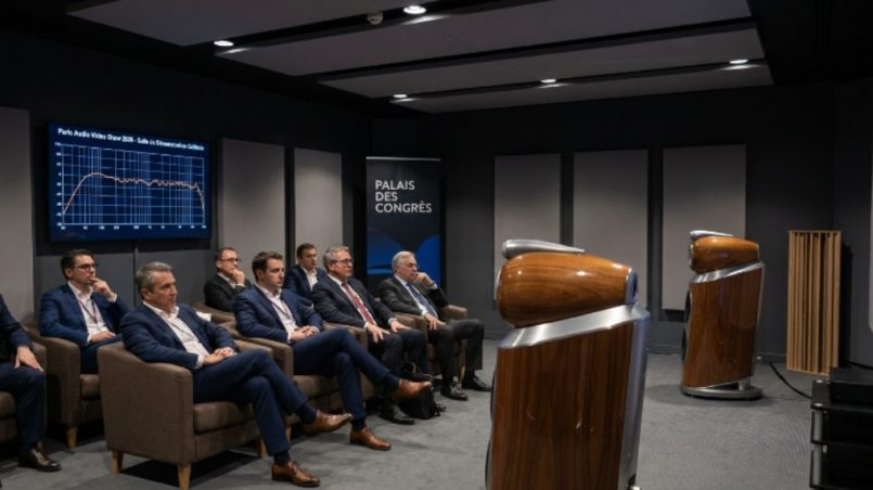 Visitors listening to high-end hi-fi speakers in a calibrated demonstration room at the Paris Audio Video Show 2026 inside the Palais des Congrès de Paris