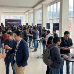 Attendees networking at AWS Community Day Bolivia 2026 event venue