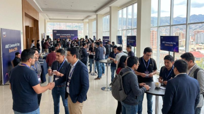 Attendees networking at AWS Community Day Bolivia 2026 event venue